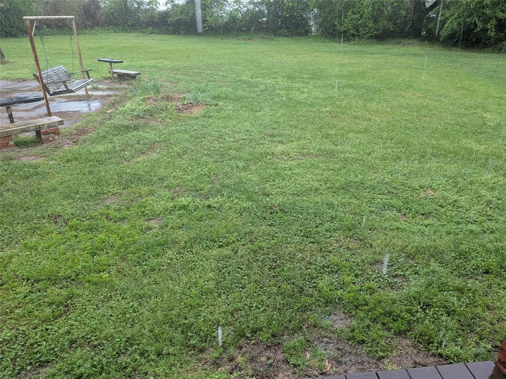 2009 County Road 4619 Athens, TX 75752 - Photo 36 of 36 a view of a field with a bench