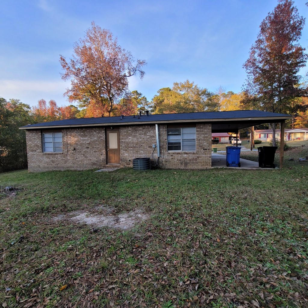 6640 Playfield Drive Columbus, GA 31907 - Photo 3 of 11 a front view of a house with garden