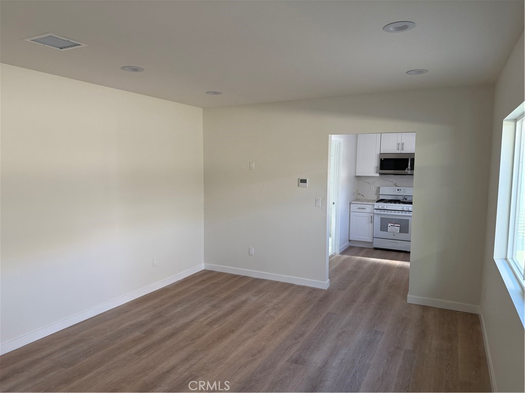 616 Alexander Street Glendale, CA 91203 - Photo 1 of 6 a view of a kitchen with wooden floor and a refrigerator