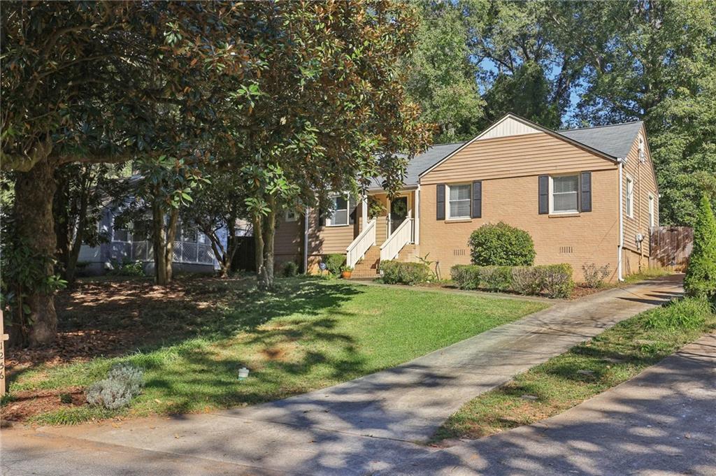 1256 Carter Road Decatur, GA 30030 - Photo 1 of 1 a front view of a house with a yard