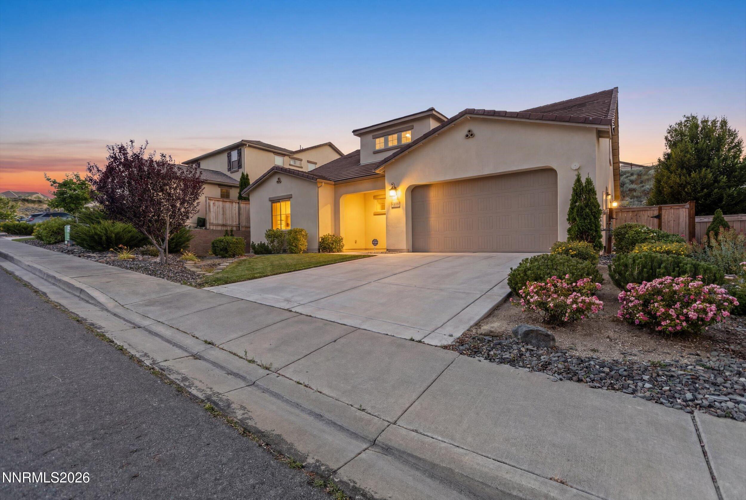 1725 Verdi Vista Court Reno, NV 89523 - Photo 4 of 37 a front view of a house with a garden
