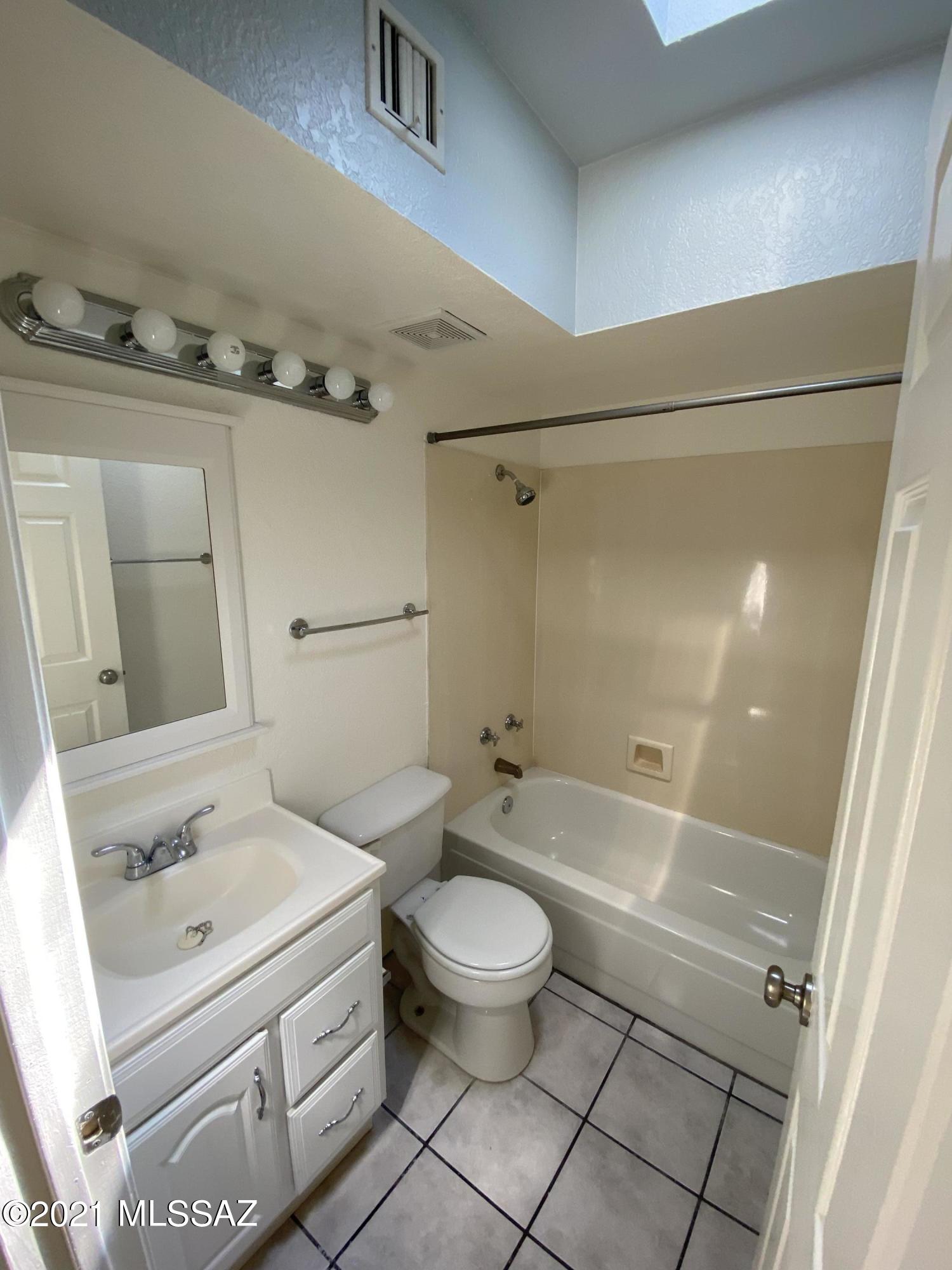 210 East Pastime Road Tucson, AZ 85705 - Photo 23 of 29 a bathroom with a sink a toilet and shower