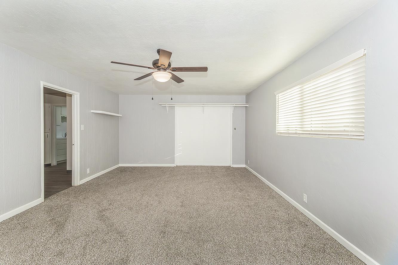 422 North Pine Street Madera, CA 93637 - Photo 18 of 54 a view of an empty room with a window