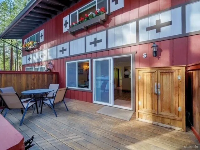 a living room with furniture a rug and a window