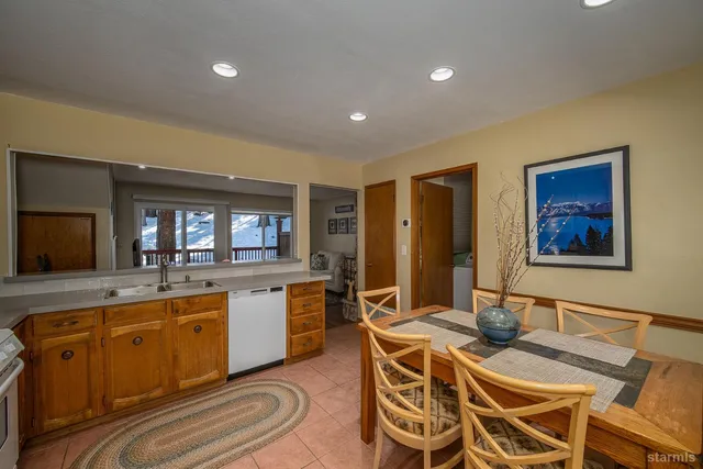 a kitchen with stainless steel appliances a stove a sink and a refrigerator