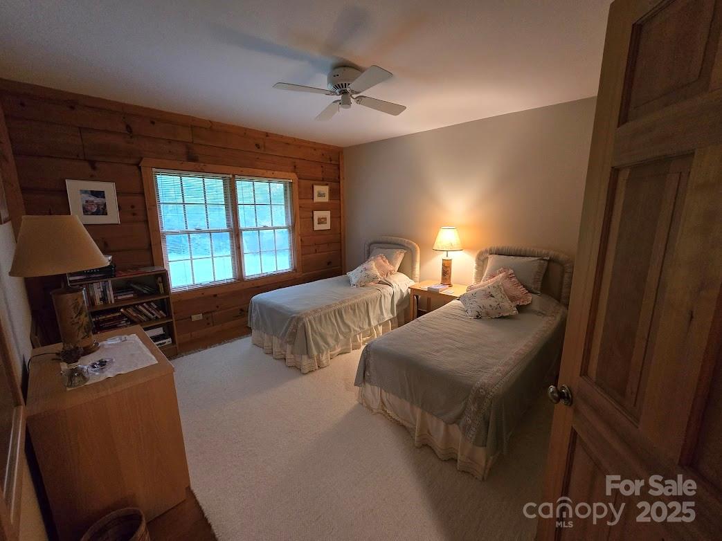 979 Wagon Road, Unit 68 Warrensville, NC 28693 - Photo 22 of 40 a bedroom with two beds and a desk