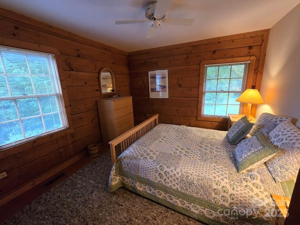 979 Wagon Road, Unit 68 Warrensville, NC 28693 - Photo 23 of 40 a bedroom with a bed and a window