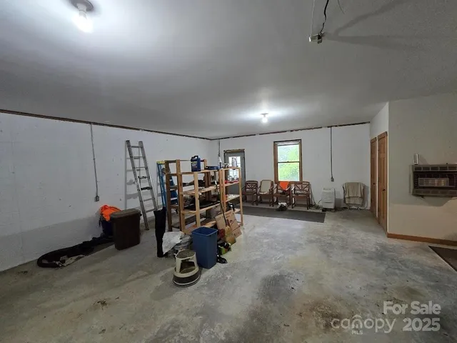 a view of a livingroom with furniture and a window