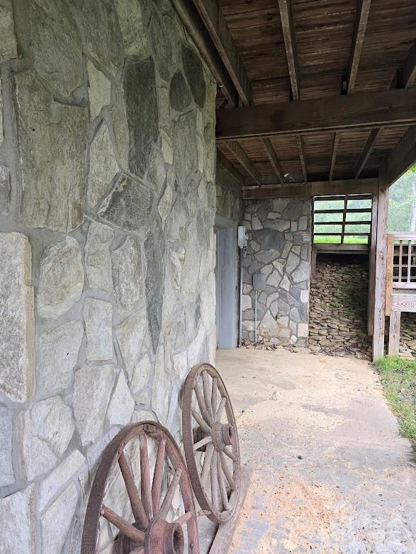 979 Wagon Road, Unit 68 Warrensville, NC 28693 - Photo 38 of 40 a view of porch with a table and chairs
