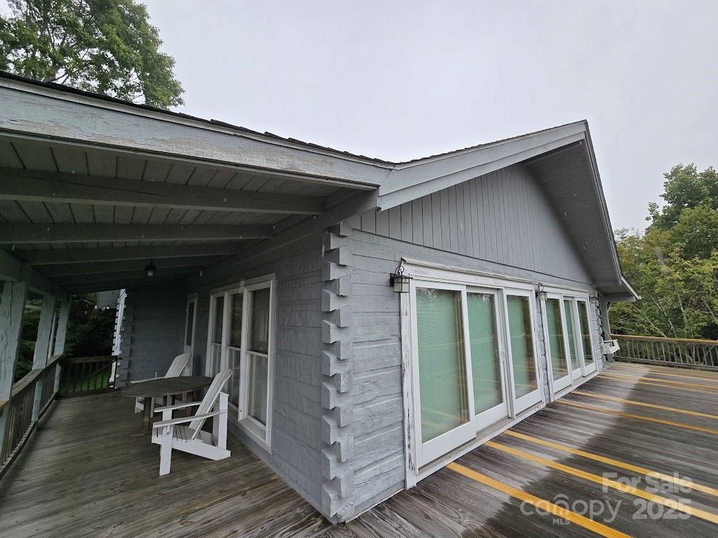 979 Wagon Road, Unit 68 Warrensville, NC 28693 - Photo 4 of 40 a patio with table and chairs and potted plants