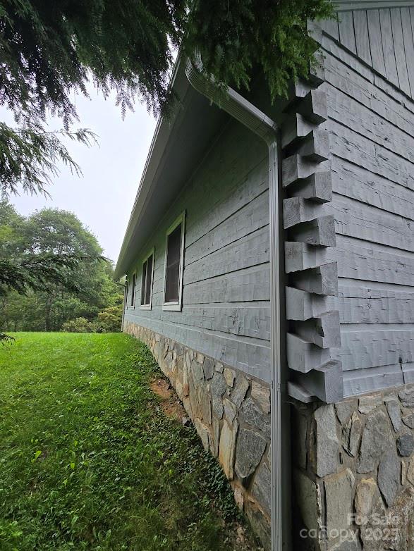 979 Wagon Road, Unit 68 Warrensville, NC 28693 - Photo 6 of 40 a front view of a house with a yard