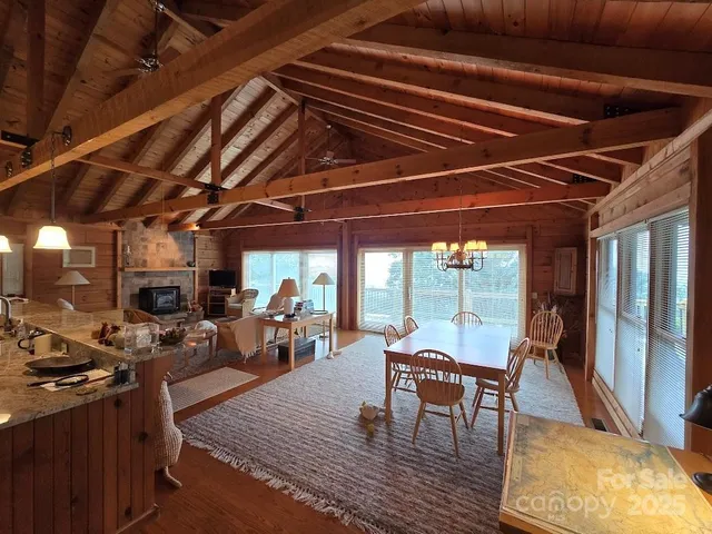 a view of a dining room with furniture wooden floor and a rug
