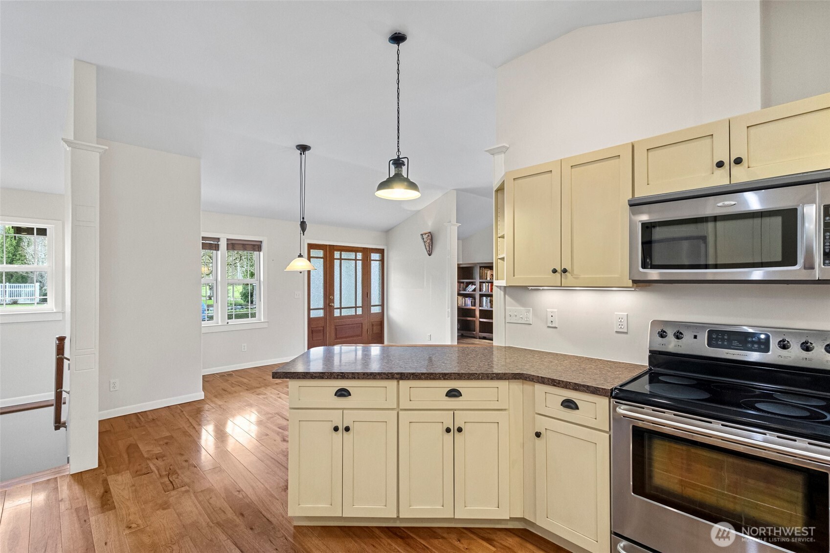 1925 Township Street Sedro-Woolley, WA 98284 - Photo 12 of 40 a kitchen with stainless steel appliances granite countertop a sink a stove a microwave and wooden floors