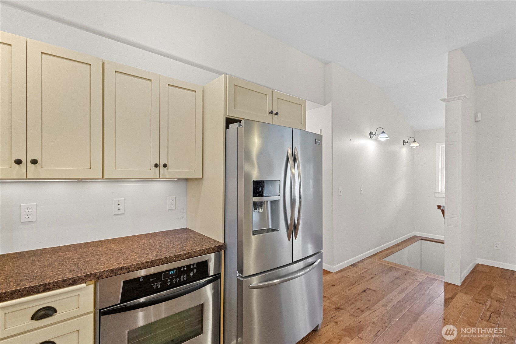 1925 Township Street Sedro-Woolley, WA 98284 - Photo 13 of 40 a kitchen with metallic refrigerator and white cabinets