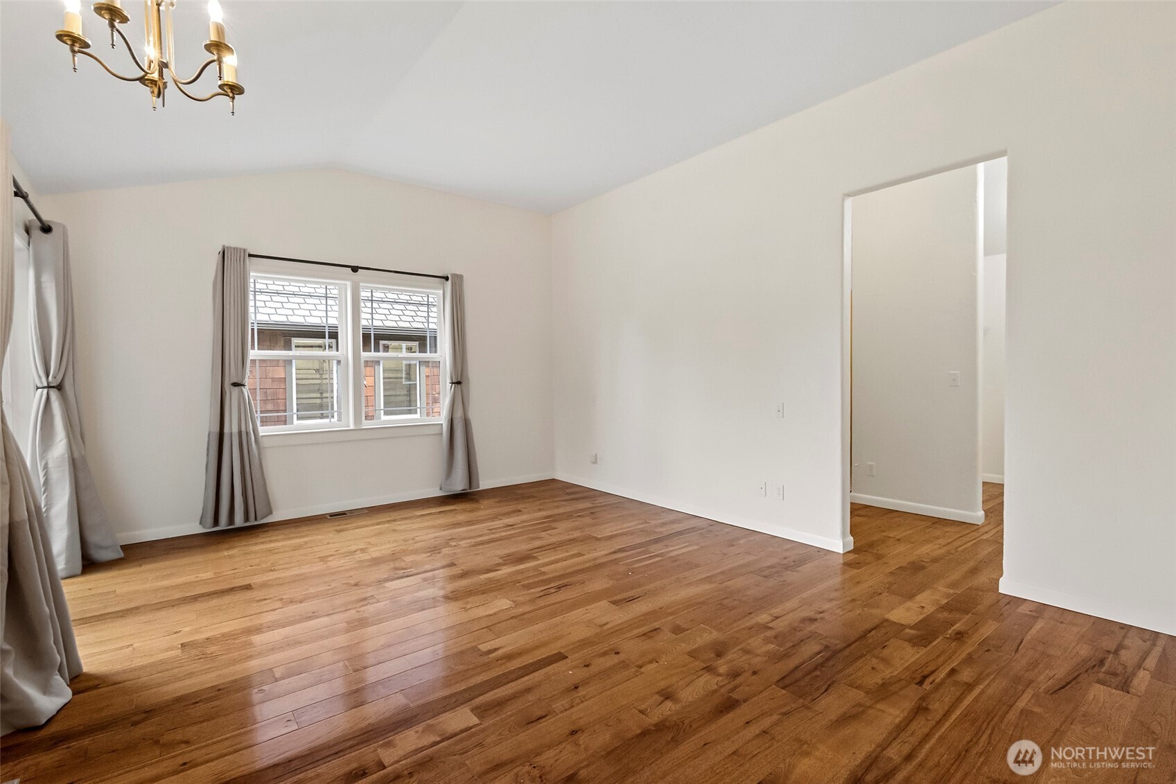 1925 Township Street Sedro-Woolley, WA 98284 - Photo 15 of 40 a view of an empty room with wooden floor and a window