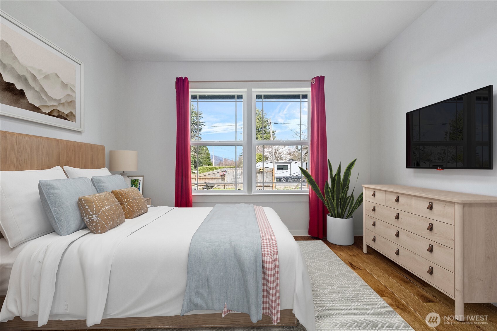 1925 Township Street Sedro-Woolley, WA 98284 - Photo 21 of 40 a spacious bedroom with a bed and a flat screen tv