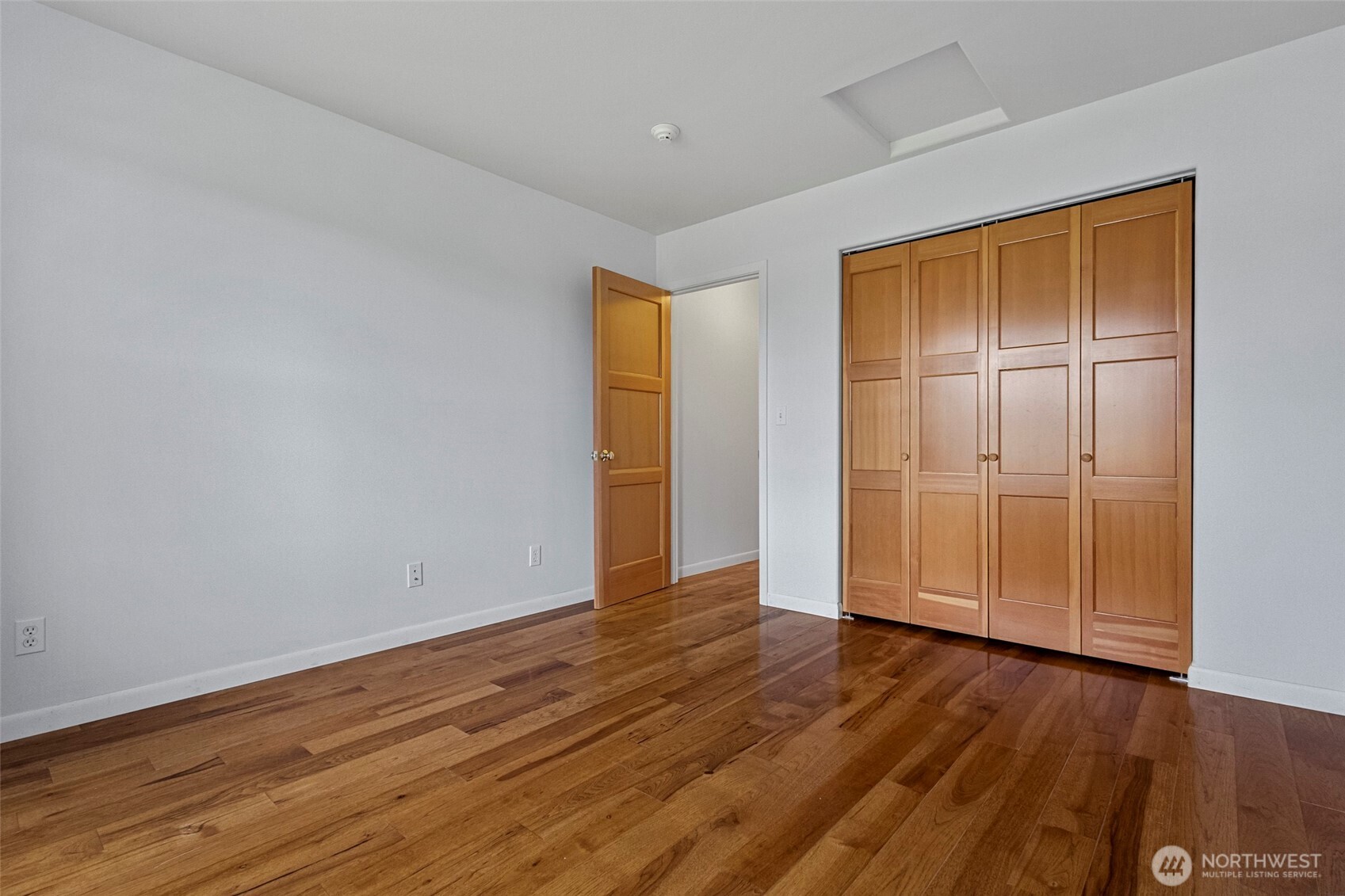 1925 Township Street Sedro-Woolley, WA 98284 - Photo 22 of 40 a view of an empty room with wooden floor and closet