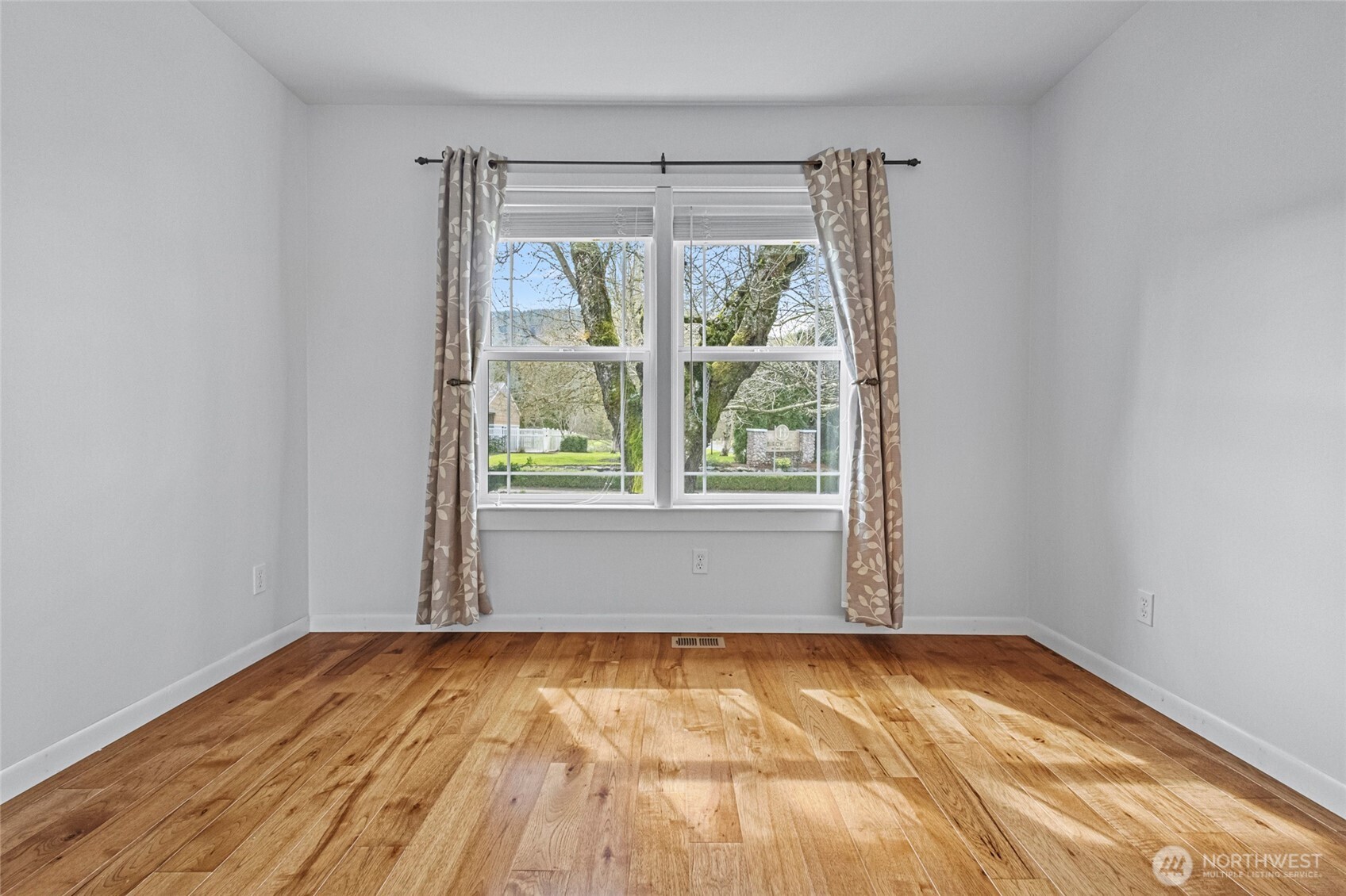 1925 Township Street Sedro-Woolley, WA 98284 - Photo 24 of 40 a view of empty room with wooden floor and fan