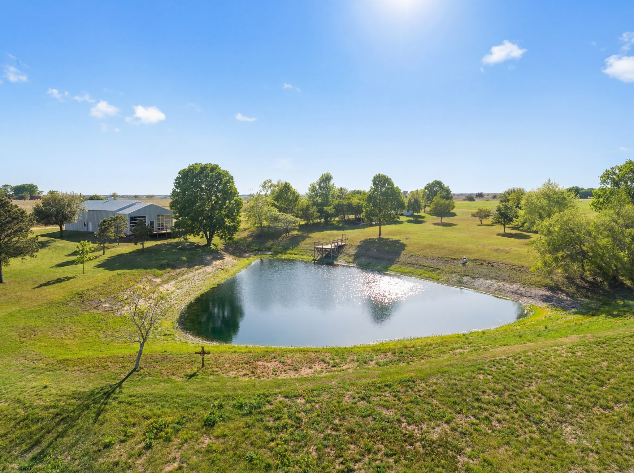 5025 Wickel Road Burton, TX 77835 - Photo 2 of 50 Charming pond surrounded by open green space and mature trees. Newly refurbished pier.