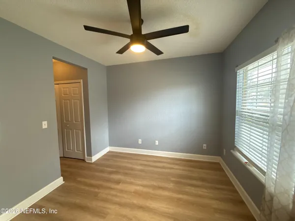 a view of an empty room with a window