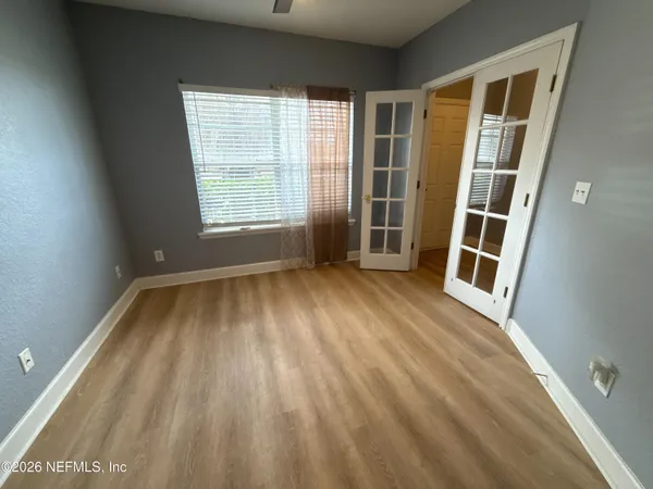 a view of an empty room with a window