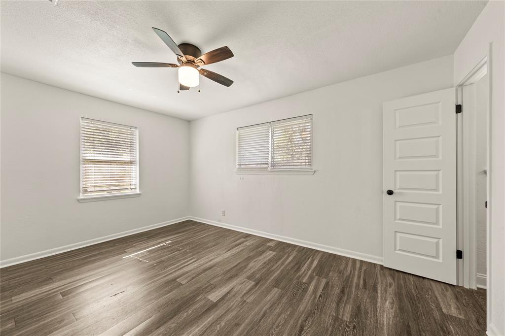 104 East Santa Anna Street Robinson, TX 76706 - Photo 28 of 36 a view of empty room with wooden floor and fan