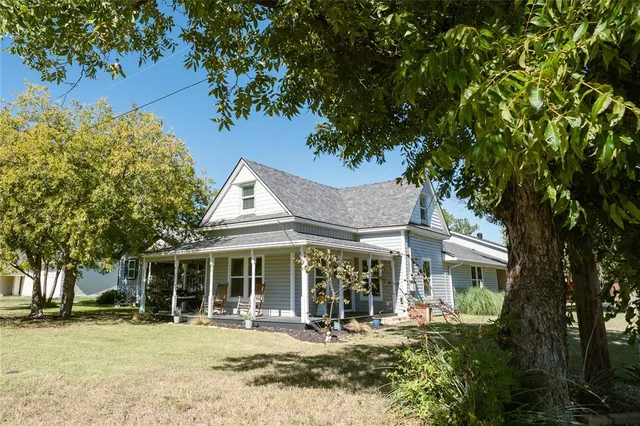 front view of a house with a garden