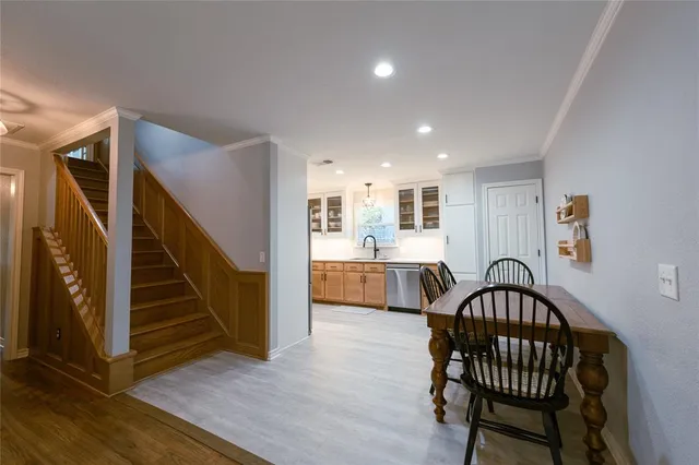 a view of dining room with furniture and wooden floor