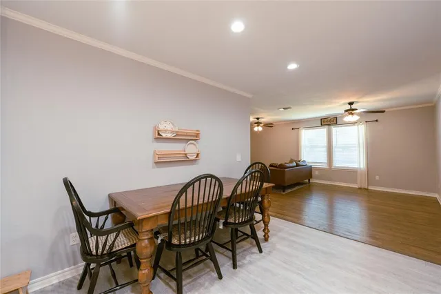 a view of a dining room with furniture and window