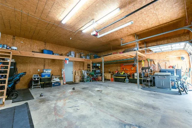 a view of a garage with parked cars