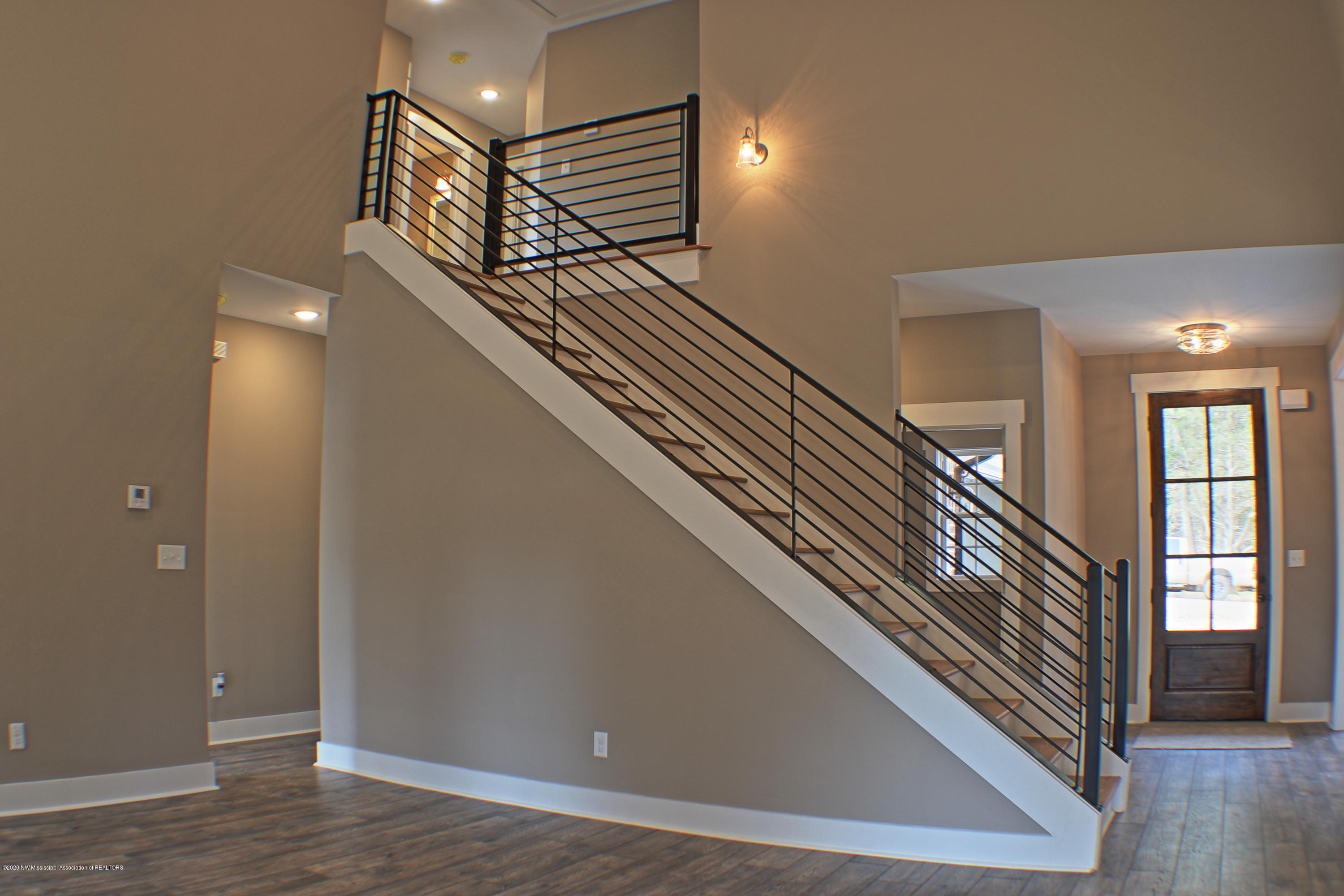 1680 Gill Road Nesbit, MS 38651 - Photo 17 of 25 living room stairs