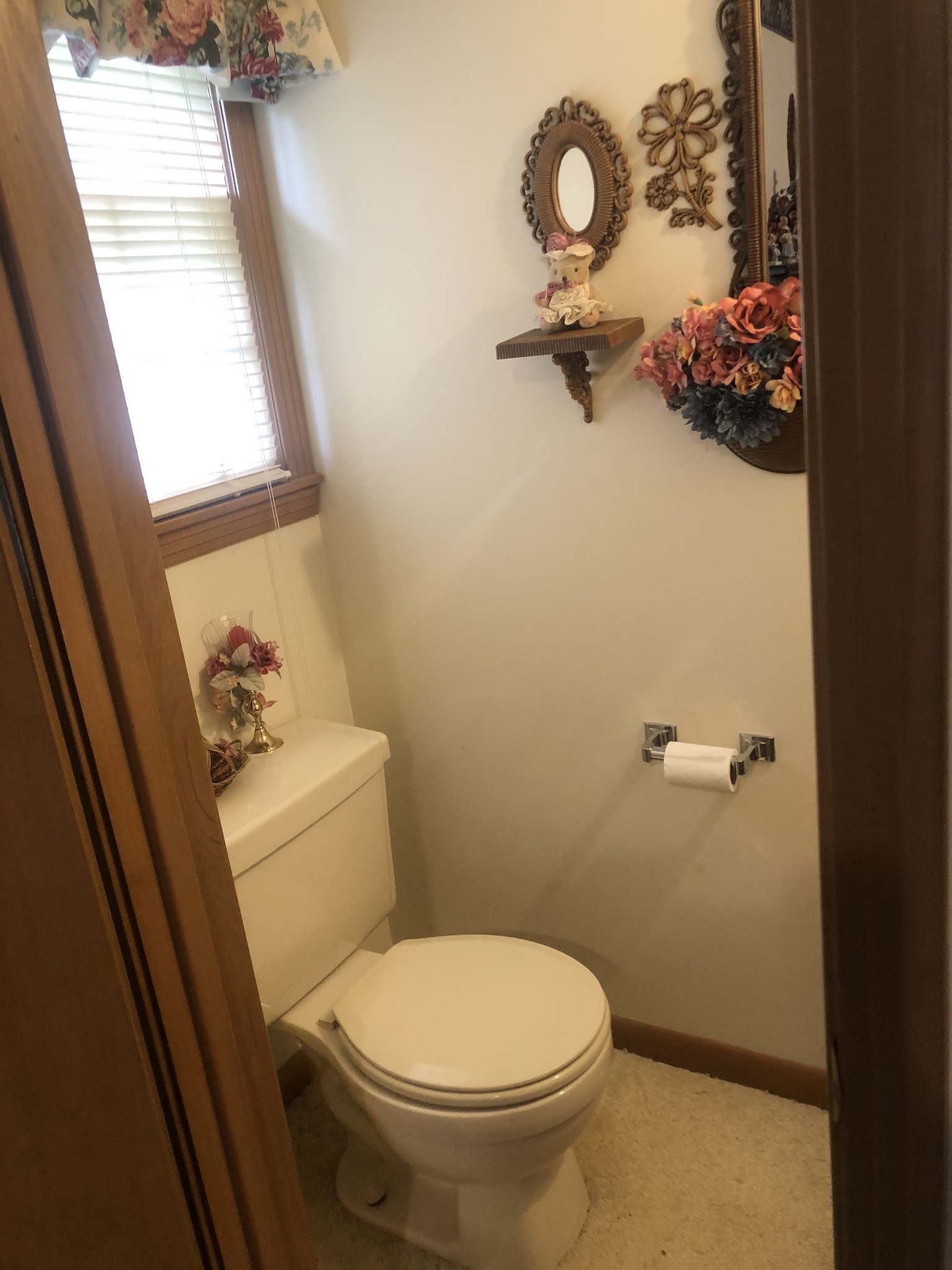5279 Oak Grove Road Red Boiling Springs, TN 37150 - Photo 15 of 23 a white toilet sitting next to a bathroom sink and a window