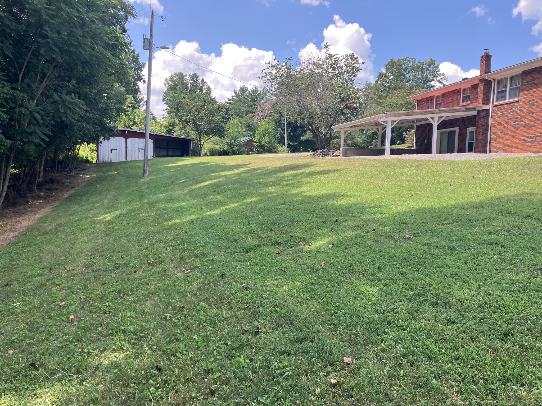 5279 Oak Grove Road Red Boiling Springs, TN 37150 - Photo 5 of 23 a view of a house with a yard