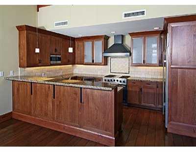 355 Hummingbird Drive, Unit B304 Avon, CO 81620 - Photo 2 of 8 a kitchen with stainless steel appliances granite countertop a stove and a refrigerator