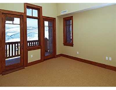 355 Hummingbird Drive, Unit B304 Avon, CO 81620 - Photo 4 of 8 a view of an empty room and window