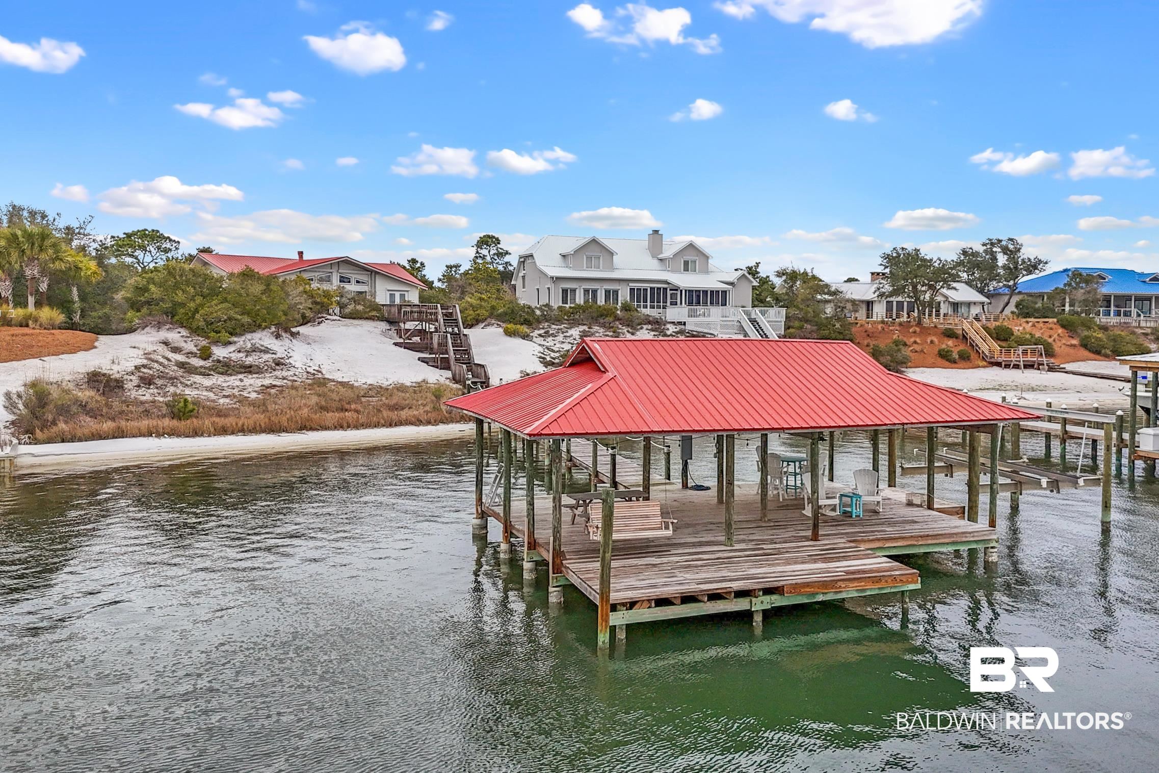 30388 River Road Orange Beach, AL 36561 - Photo 46 of 72 Dock area featuring a residential view, a water view, and boat lift