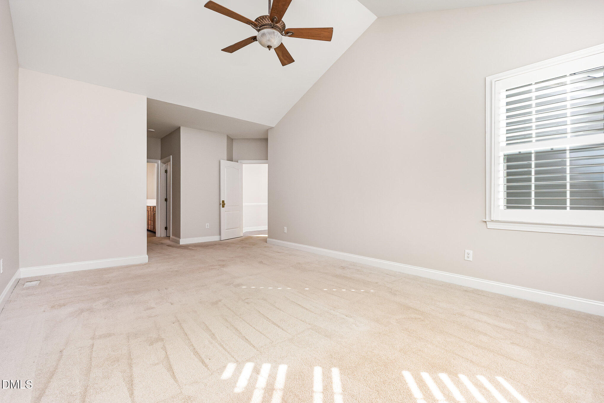 9113 Mission Hills Court Raleigh, NC 27617 - Photo 18 of 36 a view of a room with a ceiling fan and window