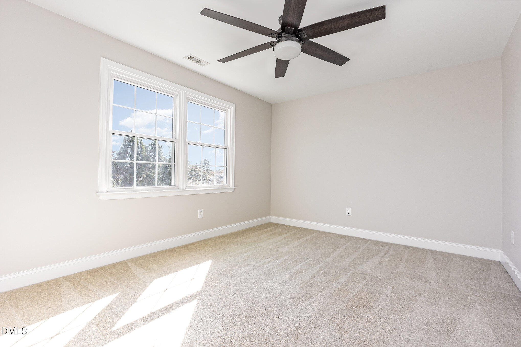 9113 Mission Hills Court Raleigh, NC 27617 - Photo 25 of 36 an empty room with windows and fan