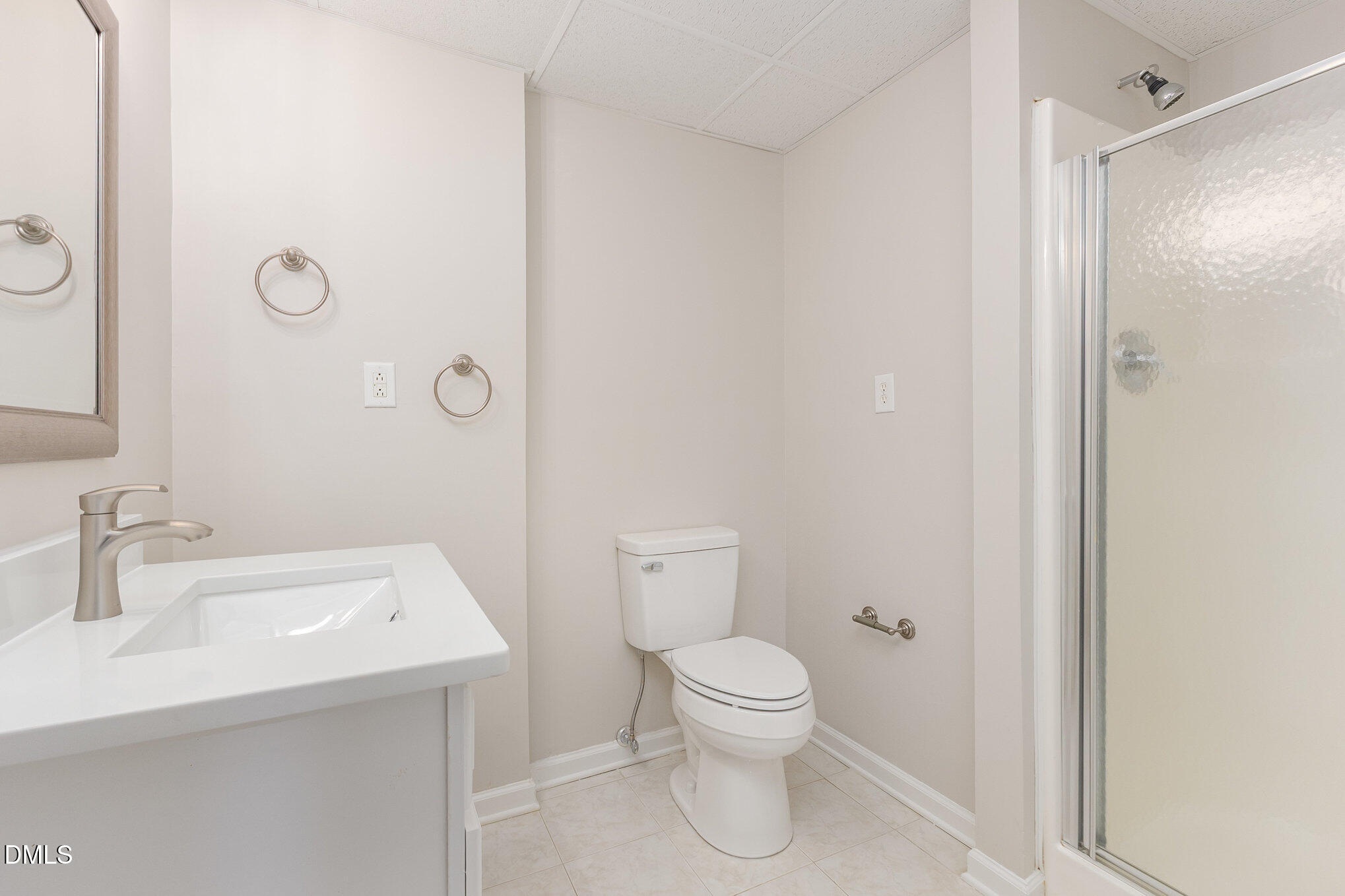 9113 Mission Hills Court Raleigh, NC 27617 - Photo 27 of 36 a bathroom with a sink a toilet and shower