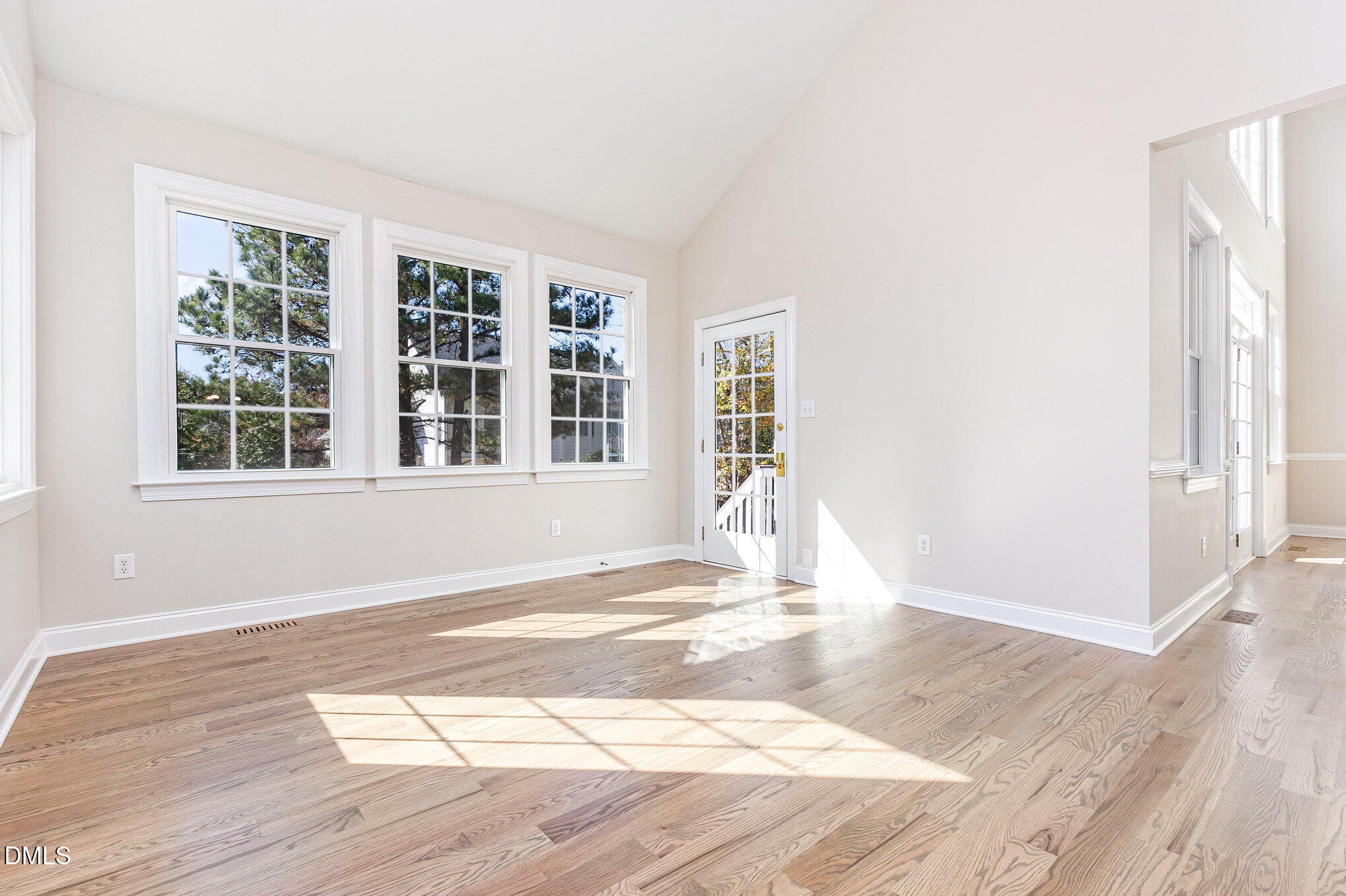 9113 Mission Hills Court Raleigh, NC 27617 - Photo 10 of 36 a view of empty room with wooden floor and fan