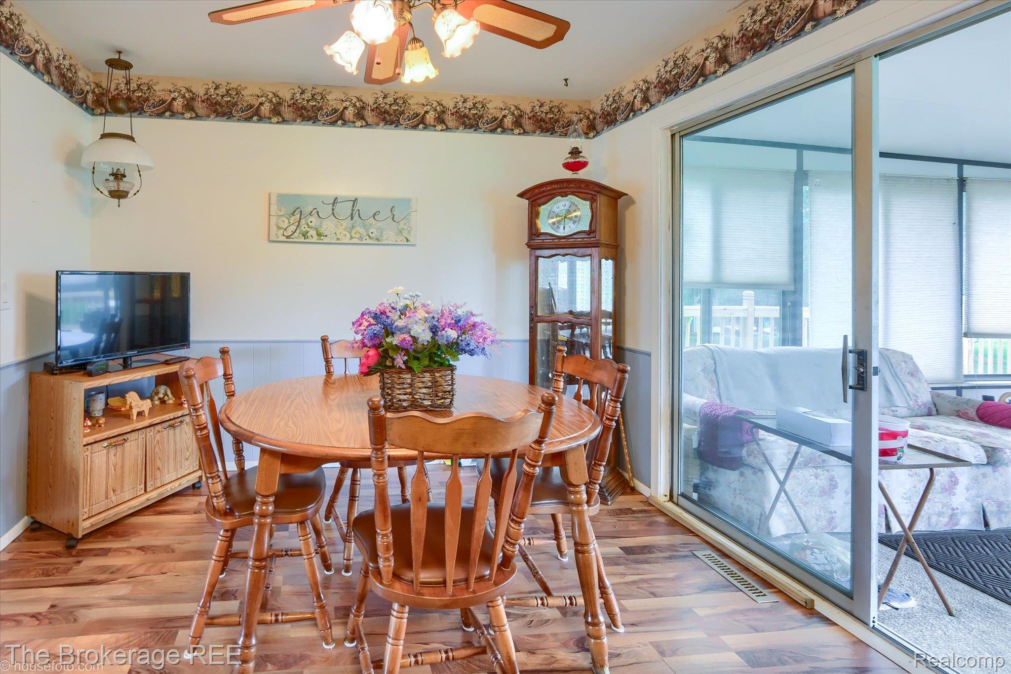 6129 East Lake Road Millington, MI 48746 - Photo 11 of 47 Dining area featuring wood finished floors and a ceiling fan