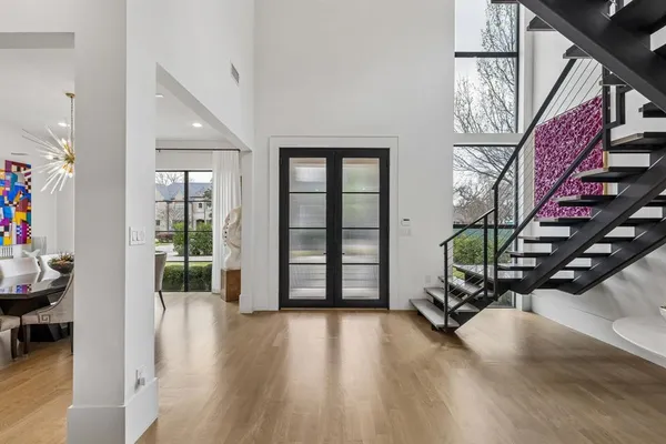 a view of an entryway with wooden floor