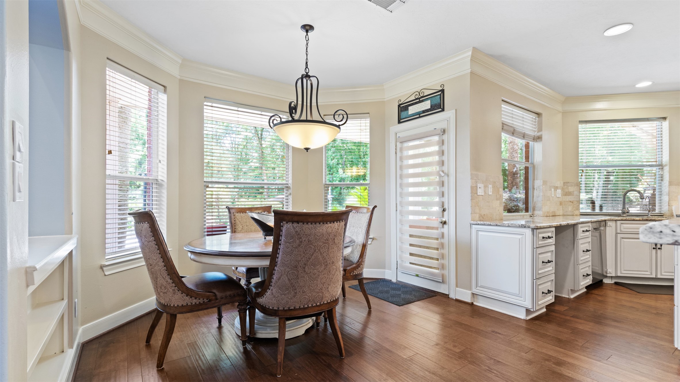 37703 Edgewater Drive Pinehurst, TX 77362 - Photo 15 of 37 a view of a dining room with furniture window and wooden floor