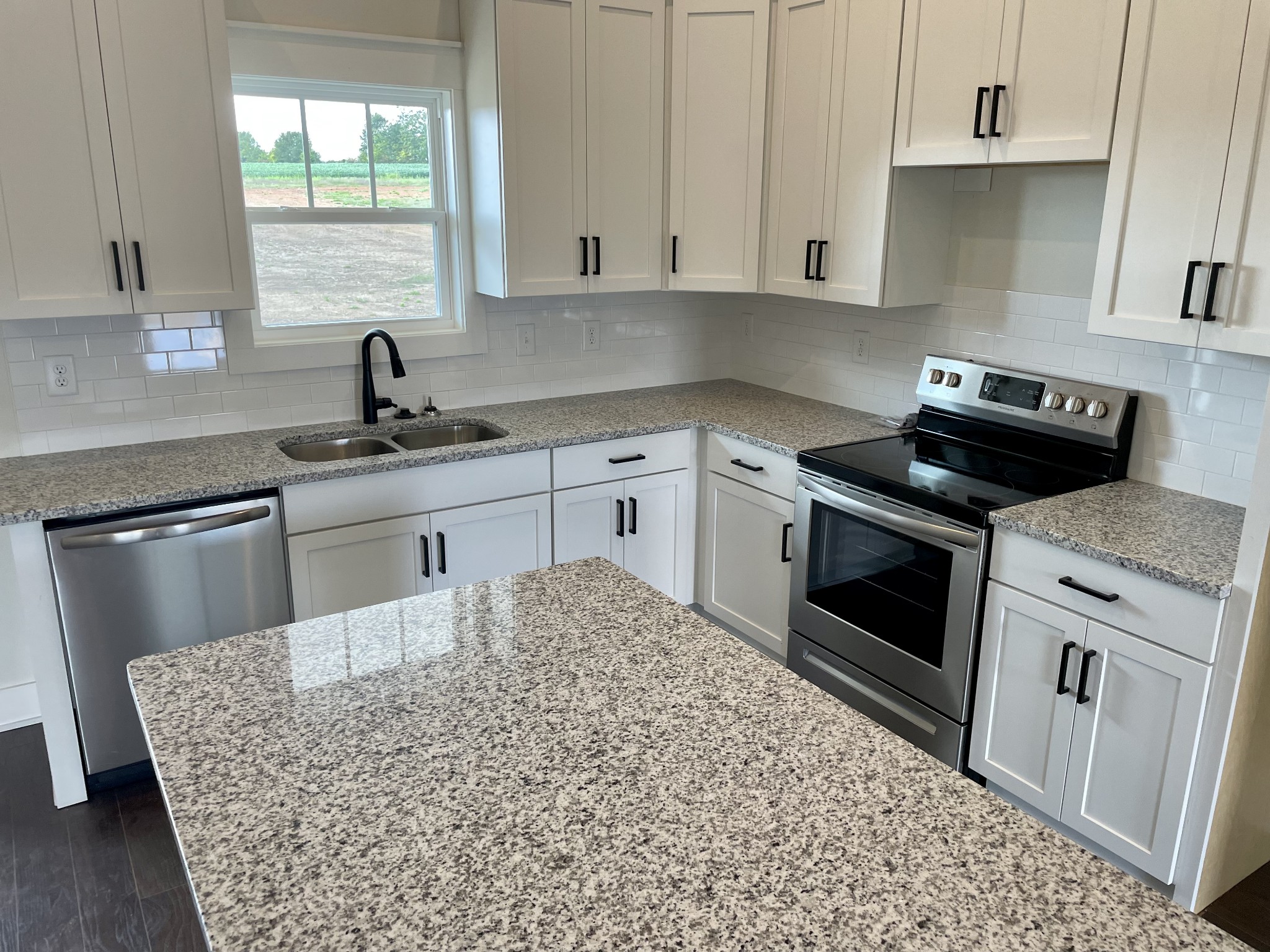 249 Tom Ferrell Road Portland, TN 37148 - Photo 16 of 28 a kitchen with cabinets appliances and a sink