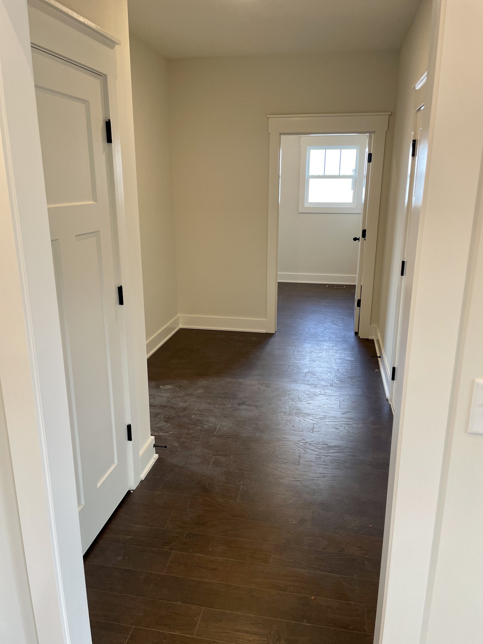 249 Tom Ferrell Road Portland, TN 37148 - Photo 27 of 28 an empty room with wooden floor and windows