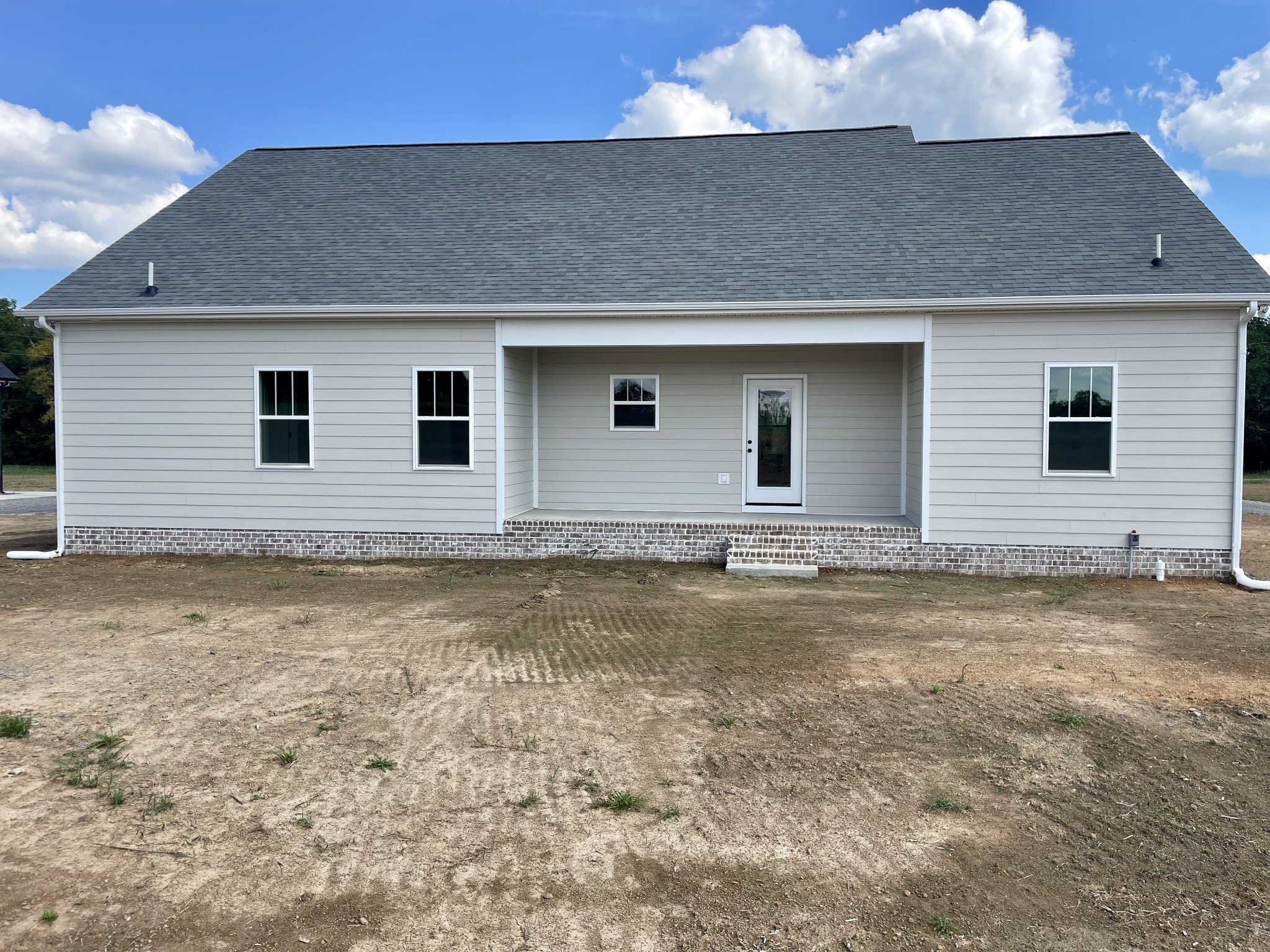 249 Tom Ferrell Road Portland, TN 37148 - Photo 6 of 28 a house view with a backyard space
