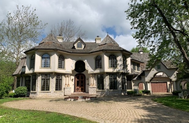 a front view of a houses on the roadside