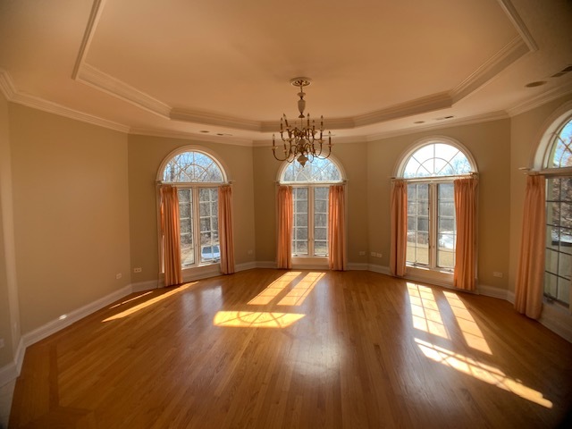 220 Bradwell Road Inverness, IL 60010 - Photo 15 of 20 a view of a room with wooden floor chandelier and windows