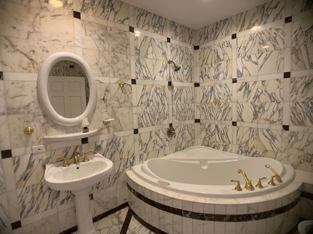 220 Bradwell Road Inverness, IL 60010 - Photo 16 of 20 a bathroom with a sink and a mirror