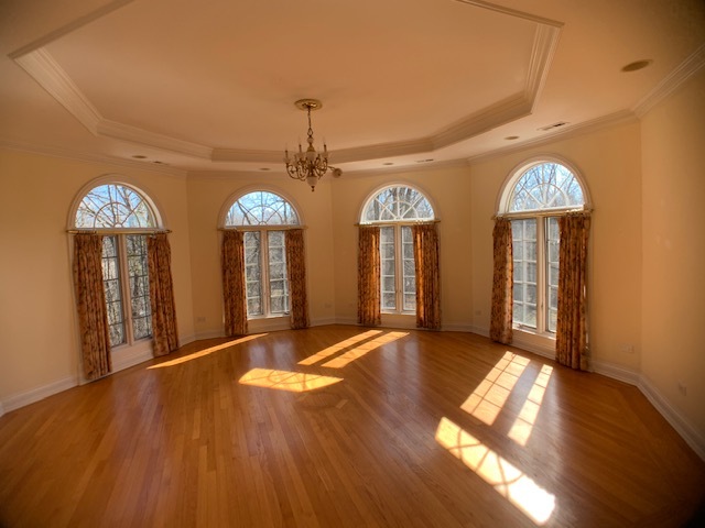 220 Bradwell Road Inverness, IL 60010 - Photo 17 of 20 a view of a room with wooden floor chandelier and entryway